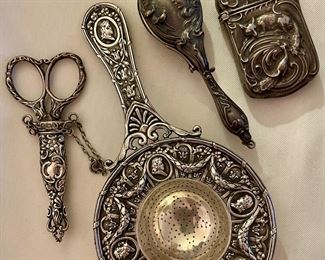 Art Nouveau silver match safe, tea strainer, sterling scissors, sterling framed folding glasses