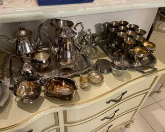 Table top full of silver plate 