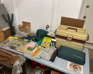 Table full of vintage fishing gear 