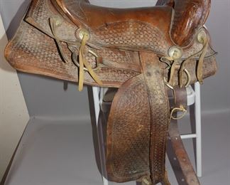 2 old leather saddles