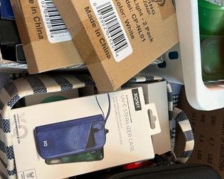 UV sterlizer case and living glow lamp light along wit other items and bins