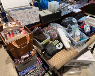 Books and storage items along with a bed and end of bed bench