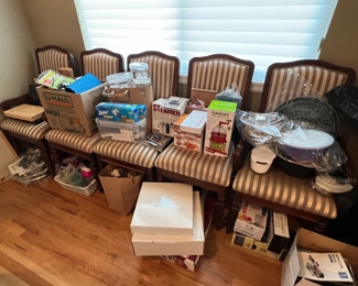 Dining room chairs and a table. Cuisinart, steamper and more