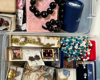 Two bins of costume jewelry 