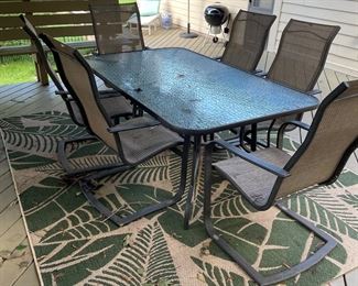 Outdoor dining table and chairs, outdoor rug
