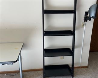 Black leaning bookshelf 
