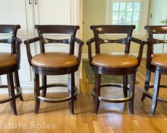 Four Woodbridge Leather Upholstered Swivel Seat Stools With Brass Foot Rail Detail
