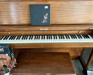 #102) - $500 - Baldwin Upright Piano with Bench.  Clean and In good working order.  