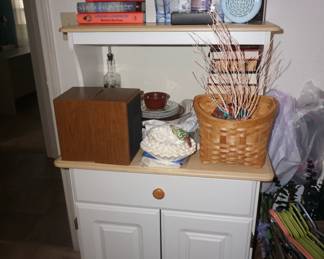 appliance cabinet, books, decor