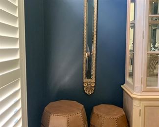 One of two matching decorative mirrors and leather-look, studded stools