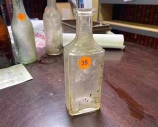  DRYDEN & CAUGHRAN GLASS BOTTLE