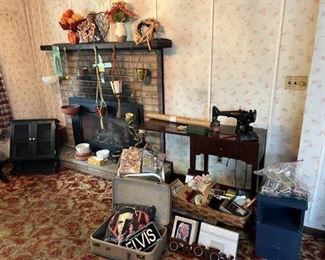 Singer sewing machine table, vintage planters, bathroom cabinet, Elvis pillow and "license" plate