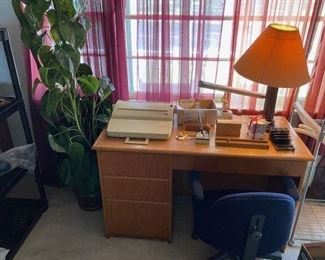 Vintage typewriter, desktop accessories, solid oak desk, office chair, artificial plant