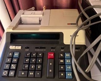 Sharp calculator with extra paper