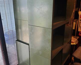 Set of (2) metal/glass front cabinets in sections