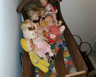 Various doll cradles, beds and TONS of dolls...