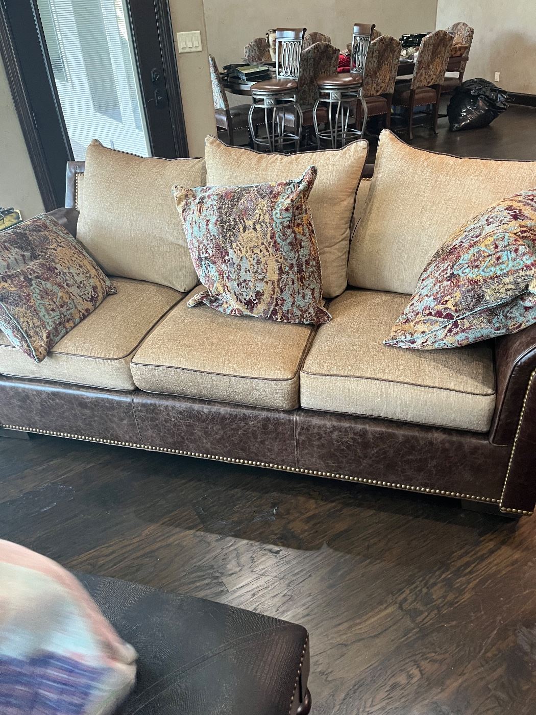 Massoud leather and fabric couch purchased at Swanns October 2022 but never used.  Also fabric  matching chairs and dining room chairs.