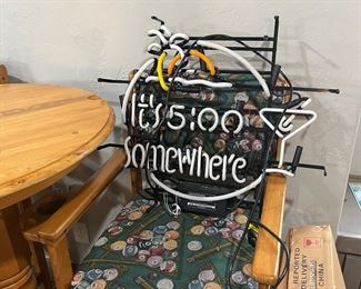 Neon sign on one of the pub table chairs