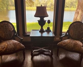 Two chairs covered with fabric like pillows on couch and dining room table chairs
