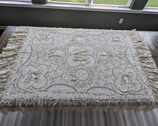 29.)  Embroidery on Swiss Batiste with Mixed Laces Table cover.  Flounced.  Museum de-accession.  Small Pin holes in netting.  72" long x 60" wide.  $325.00