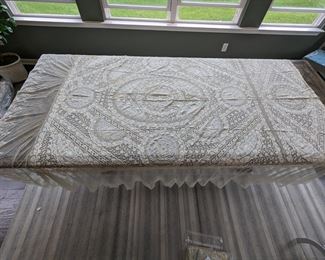 18.)   Handmade 19th Century Normandy Lace Bedspread Embroidered on Swiss Linen Batiste and net.  Silk liner.  Silk lining intact.  Minor age discoloration and 1 small repair.  Structurally sound.  102" x 92"  $450.00
