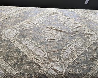 16.)  19th Century Normandy Lace Bedspread Embroidered on Swiss Linen Batiste and net.  French with silk liner.  Silk lining intact.  Some staining.  Structurally sound.  82" x 92"  $450.00