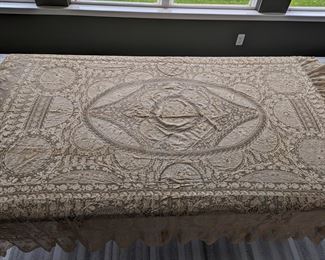 7.)  ca 1880 Bobbin Lace and Embroidery on Swiss Linen Batiste Bedspread.  Embroidery on netting.  Heavily flounced applique on netting.  2 small holes in edge of flounces.  80" wide x 85" long.  $425.00