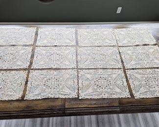 6.)  ca 1900  - Set of 12 Mixed Lace Placemats.  Belgian Tape Lace.  Applique on netting.  Some staining.  18" long x 11" wide.  $325.00