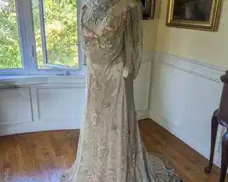 9.)  ca 1900's to 1910 Lace  Evening Gown, embroidered lace, pink velvet trim, train.  Very good condition except at neck.  Some wear to beadwork at chest.  Occasional pull in embroidery. Seam on right shoulder needs repair and also 1 piece of beadwork in the netting.  Gown has been relined.  Measures:  shoulder to shoulder  - 14",  Bust -  28",  Waist  - 32",  Length  - 64",  Length with train - 75"     $380.00