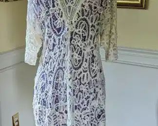 8.)  19th century tape lace jacket.   Needs minor repairs.  Jacket is basically in good condition with some breaks in the brides/webbing.  Handmade.   Measures:  shoulder to shoulder - 14",  Length 35"    $475.00