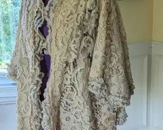 12.)  ca 1880's - 1890's Handmade Brussels Belgian tape lace and silk  jacket.  Fancy Ruching for flounce.  Inside silk lining is shattered.  Aside from a few stains, the lace is in excellent condition.   Measures:  Shoulder to shoulder - 15",  Bust - 19", Length 26".      $585.00