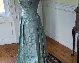 5.)  ca 1840's   Sea foam blue/green brocade 2 piece gown.  Mainly hand sewn.  Boned bodice.  Hook and eye closure.  Some underarm stains but no damage.  A few other tiny stains on bodice.  Very good condition.   Measures:  shoulder to shoulder 17",  Bust 30",  Waist 22"     $725.00