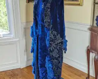 33.)  ca 1870's Blue Velvet Opera Mantle with beading, feathers, and tassels.  Velvet is a deep royal blue and heavily beaded.  Back of mantle has accommodation for bustle and is heavily beaded and feathered.  Some shedding of feathers.  Stunning!!  Near mint condition.  $1400.00