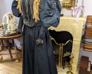 41.)  1890's 2 Piece Costume with Velvet and Lace.  Large leg-o-mutton sleeves. Sleeves had a velvet flower.  Velvet cuffs.  Lace has 1 hole and is a bit fragile.  I believe the lace was added at a later date.  Slight train.  1 light stain on the skirt - barely noticeable.  A few marks around the hemline.  Should clean out.  Overall, excellent condition.    Measures:  Bodice:  Shoulder to Shoulder - 13",  Bust - 22",  Waist - 26",  Length - 19".  Skirt:  Waist - 25",  Length - 41",  Total Length - 60".   $465.00