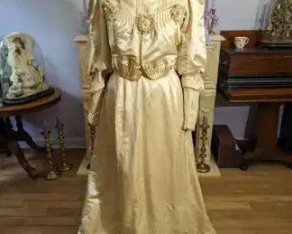 37)  1890's Ivory Satin Bridal/Wedding Gown.  A few stains on skirt.  Dirt on edge of hem.  1 Small wear spot on back.  Train.  Larger Size.  Excellent condition.   Measures:  Shoulder to shoulder - 13",  Bust - 35",  Waist - 28",  Length - 58".   $465.00