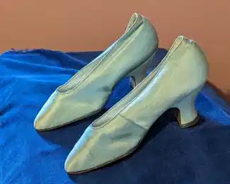 4.)  Antique Green Satin Evening Shoes Labeled Frank Brothers, New York.  Shoes and satin are in very good condition but do have some discoloration.  Measures:  9 3/4" x 2 3/4".  $142.00