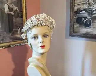 1.)  ca 1920's Wax Floral Bridal/Wedding Crown.  Wrapped wire frame with wax orange blossoms and buds.  Satin Ribbon hanging from the back.  Wire ring  measures 8" diameter.  Excellent condition.    $198.00