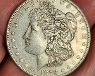 Many silver dollars, and other silver and gold coins.