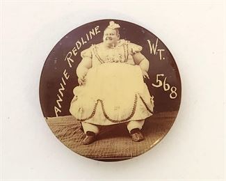 Rare celluloid pinback button advertising Annie Redline, a sideshow "fat lady" performer with the Parker Amusement Company from 1906 to1907. She was a native of Sabetha, Kansas and was billed as the heaviest woman in the world. She was 4'8" tall, measured 7'11" at the waist, and weighed 611 pounds. Excellent condition. 