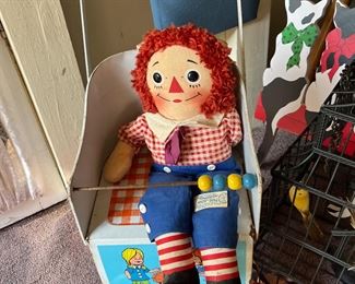 Vintage Raggidy Ann doll on vintage stroller