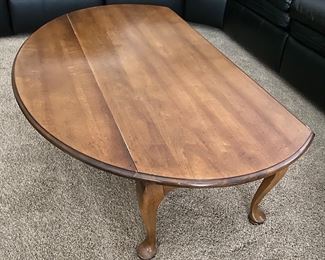 Coffee table with drop leaf