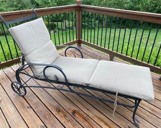 Black metal lounge chair with cushion