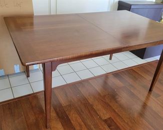$700

Lane mid century Wood dining table with 2 leaves and table pads 

Dimensions: 64" W x 30" H x 38" D
2 Leaves 18” each