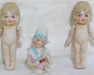 545 - 2 Bisque dolls & pin cushion lady figure
