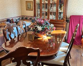 Beautiful dining room table with six chairs and leaves. Also includes table pads.