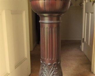 Solid Mahogany with revolving top.