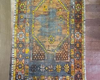 Well-Worn Orange Tone Woven Carpet
