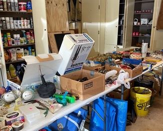Lots of garage, fishing supplies, neoprene boots, waders, tarps, stadium seating, lawn mower, fishing poles and all the fishing gear imaginable 