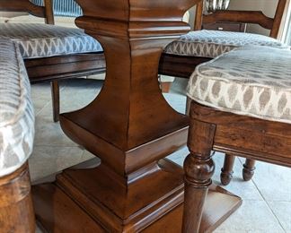Beautiful Hooker pedestal table with four chairs and custom cover pads 