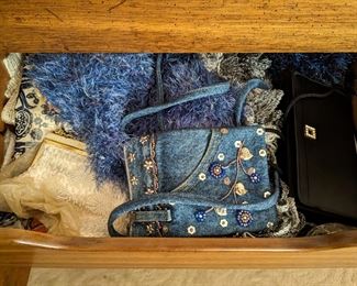 Lots of ladies handbags, vintage and current